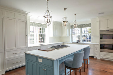 Large elegant u-shaped dark wood floor and brown floor kitchen pantry photo in Bridgeport with a single-bowl sink, beaded inset cabinets, white cabinets, marble countertops, white backsplash, wood backsplash, stainless steel appliances, an island and white countertops