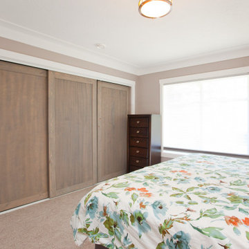 Custom Wood Sliding Closet Doors in Contemporary Primary Bedroom