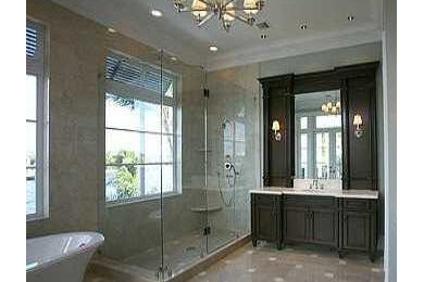 Bathroom - large transitional master beige tile and stone tile marble floor bathroom idea in Miami with an undermount sink, furniture-like cabinets, dark wood cabinets, marble countertops, a one-piece toilet and gray walls