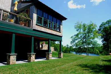 Inspiration for a mid-sized traditional full sun backyard concrete paver landscaping in Providence for summer.