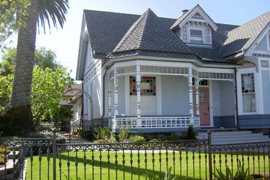Example of a mid-sized ornate blue two-story vinyl exterior home design in San Luis Obispo