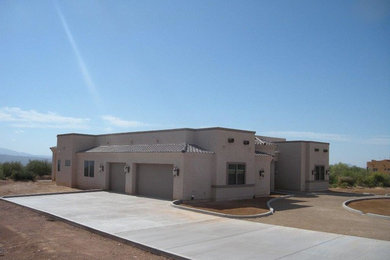This is an example of a mid-sized traditional attached garage in Phoenix.