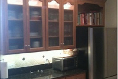 Small traditional galley separate kitchen in Miami with no island.