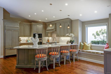 Open concept kitchen - mid-sized coastal u-shaped medium tone wood floor and brown floor open concept kitchen idea in Miami with an undermount sink, recessed-panel cabinets, gray cabinets, granite countertops, gray backsplash, ceramic backsplash, stainless steel appliances and a peninsula