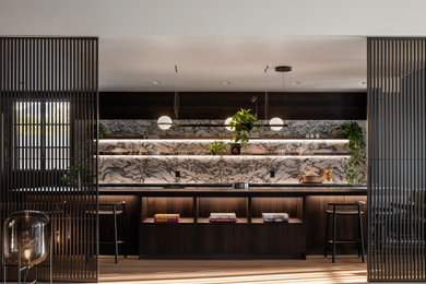 Example of a large trendy kitchen design in San Francisco with marble countertops and marble backsplash
