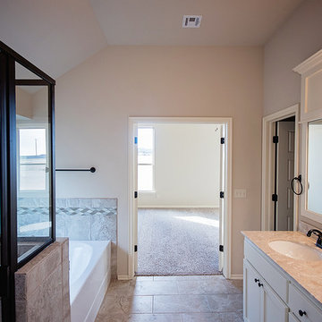 Spacious Master Bathroom with Separate Tub and Shower