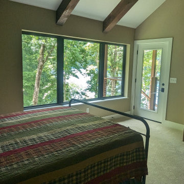 A Master Bedroom with a Lake View