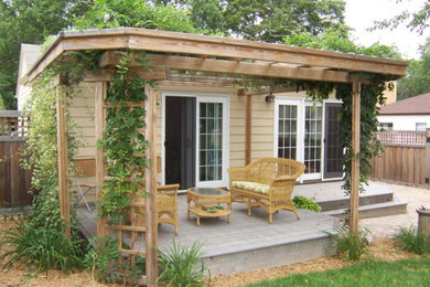 Inspiration for a mid-sized contemporary backyard stone landscaping in Minneapolis.