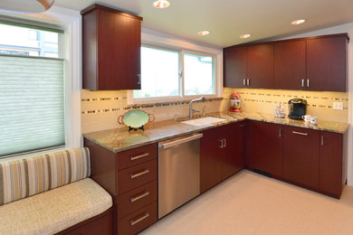 Photo of a mid-sized midcentury l-shaped separate kitchen in Seattle with a double-bowl sink, flat-panel cabinets, dark wood cabinets, marble benchtops, beige splashback, ceramic splashback, stainless steel appliances, porcelain floors, no island, beige floor and green benchtop.