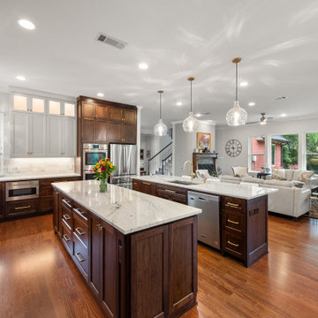 Full-view transitional kitchen with white upper cabinets and custom plaster hood