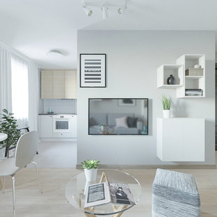 Inspiration for a small scandinavian open plan living room in Other with grey walls, laminate floors, a wall mounted tv and pink floors.