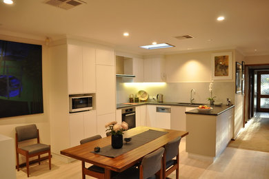 Photo of a small contemporary u-shaped eat-in kitchen in Canberra - Queanbeyan.