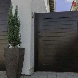 Mediterranean Garage Doors with Matching Entry Gates - Home Fencing And Gates