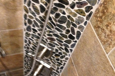 Inspiration for a rustic beige tile and porcelain tile bathroom remodel in Little Rock
