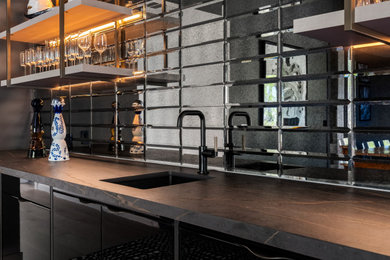 Inspiration for a modern home bar remodel in Austin