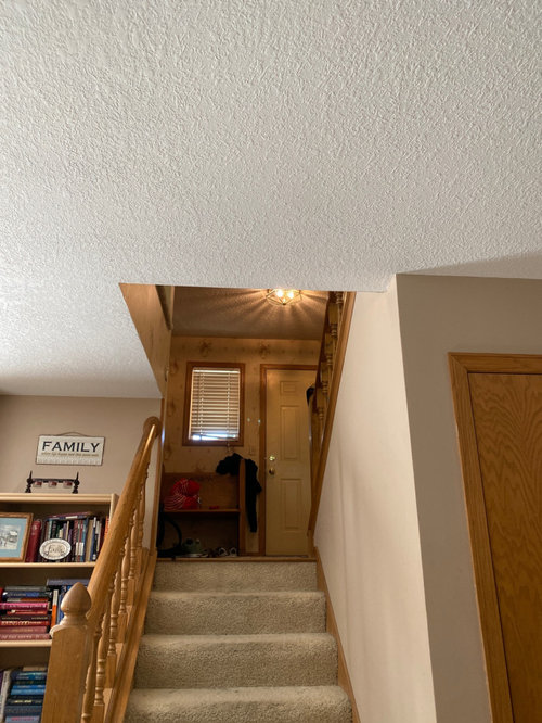 textured and smooth/ flat ceilings in same house