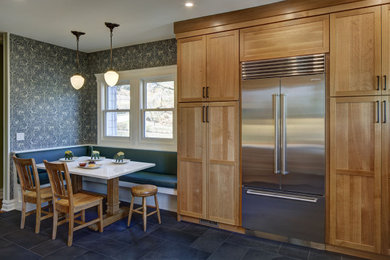 Example of a large arts and crafts porcelain tile and gray floor kitchen design in New York with an undermount sink, shaker cabinets, medium tone wood cabinets, quartz countertops, green backsplash, ceramic backsplash, stainless steel appliances, no island and white countertops