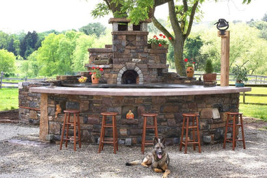 Mid-sized arts and crafts backyard gravel patio kitchen photo in Philadelphia with no cover