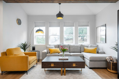 Inspiration for a modern brown floor living room remodel in Vancouver with white walls