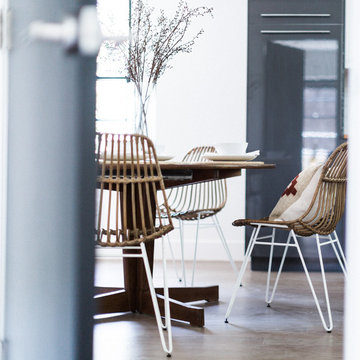 Rattan Paperclip Leg Dining Chairs with Vintage Dining Table in Open Plan Kitche