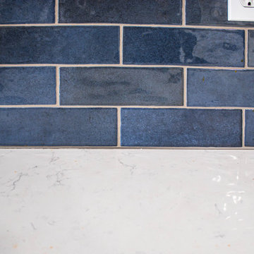 Two Tone Kitchen: Navy and Wood Kitchen with Carrara Wind Quartz Countertops