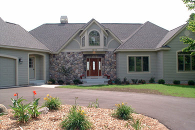 Large elegant gray exterior home photo in Other