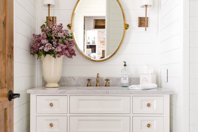 Example of a small cottage 3/4 single-sink bathroom design in Columbus with shaker cabinets, white cabinets, marble countertops, gray countertops and a freestanding vanity