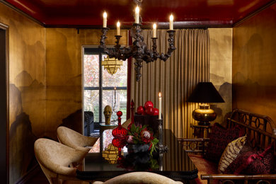 Example of a small transitional wallpaper, brown floor and medium tone wood floor enclosed dining room design in Denver with multicolored walls