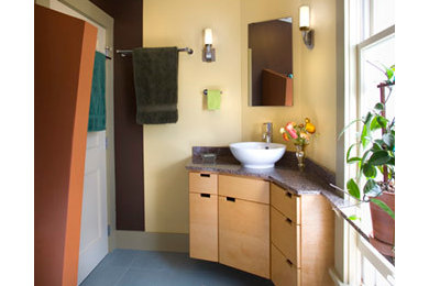 Inspiration for a contemporary master multicolored tile bathroom remodel in Minneapolis with a vessel sink, flat-panel cabinets, light wood cabinets, granite countertops and multicolored walls