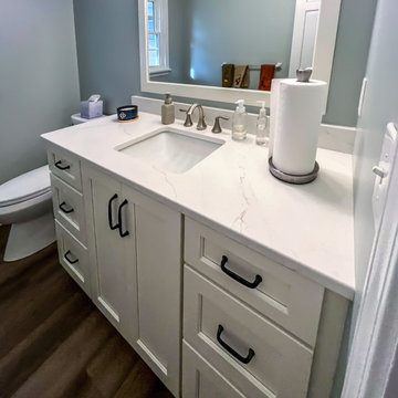 Powder Room with Custom White Vanity and Laventa Snow Quartz Countertop
