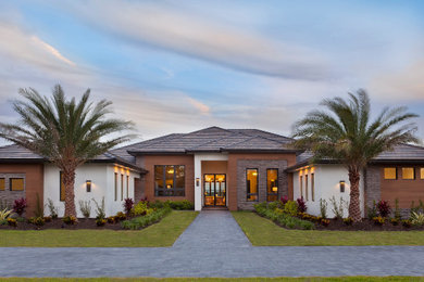 Example of a trendy home design design in Tampa