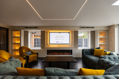 Photo of a large modern formal and cream and black open plan living room feature wall in Buckinghamshire with beige walls, dark hardwood flooring, a standard fireplace, a wooden fireplace surround, a built-in media unit, black floors and wallpapered walls.
