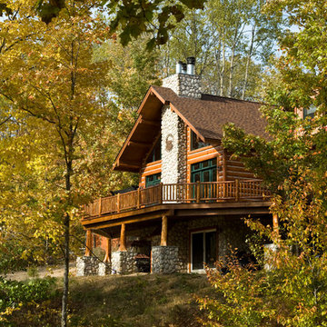 Half log siding with chinking spacers