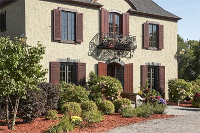 Example of a tuscan exterior home design in Minneapolis