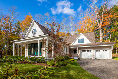 Mid-sized traditional beige two-story vinyl gable roof idea in Portland Maine