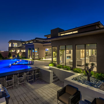Rim Flow Pool & Spa with Sunken Retreat with BBQ and Glass Walled Fire Pit