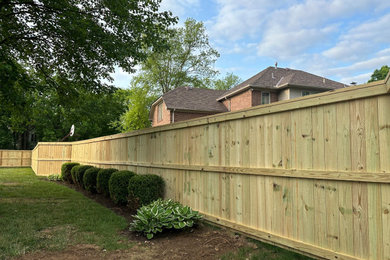 Inspiration for a backyard wood fence landscaping in Other.