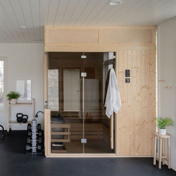 Home Gym with Sauna by KH Interiors