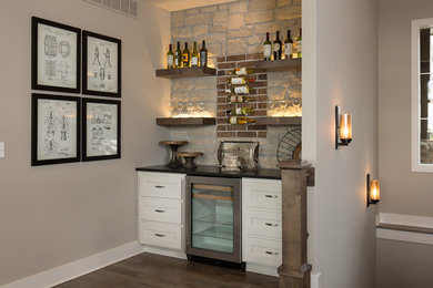 Example of a transitional home bar design in Kansas City