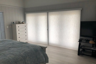 Minimalist bedroom photo in Other