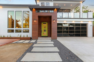 Mid-sized contemporary white two-story stucco exterior home idea in Sacramento