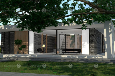 Стильный дизайн: двухэтажный, кирпичный, черный дом в современном стиле с плоской крышей - последний тренд
