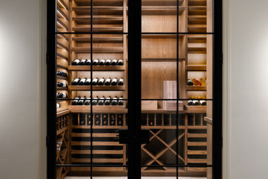 Inspiration for a mid-sized modern wine cellar remodel in Chicago