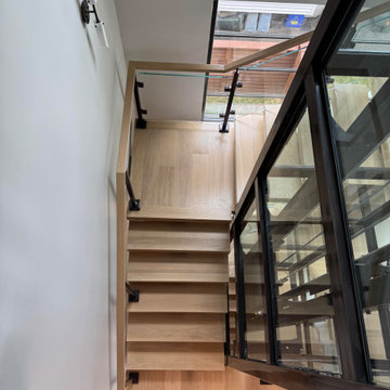 Project #136 | Modern Floating Staircase Encircling Glass Elevator