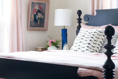 Mid-sized eclectic master medium tone wood floor bedroom photo in Chicago with pink walls and no fireplace