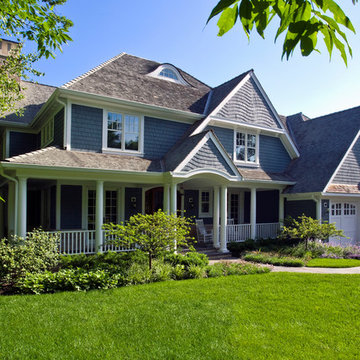 Stone and Cedar Shingle Gabled Roof Lakefront Home