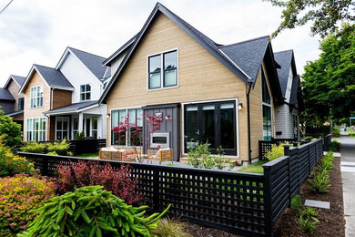 Example of a beach style two-story metal exterior home design in Vancouver