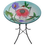 Teamson Home - Solar Bird Bath & Lights Outdoor Garden - Provide a gathering space in your backyard for your feathered friends with the Teamson Home 18" Outdoor Solar Glass Hummingbird Birdbath with LED Lights and Stand. This colorful glass birdbath provides a sanctuary for all types of birds while also adding a pop of color to your outdoor living space, yard, or lawn. Featuring a multi-colored design with flowers and hummingbirds, this stylish lawn decoration creates visual interest in your outdoor area. Fill this birdbath with water or with seed to transform it into a colorful feeder. This birdbath also includes a solar cell that charges during the day and lights up the built-in LEDs at night to illuminate your garden. Constructed from sturdy and resilient glass with an included metal stand, the bird bowl is built for years of quality outdoor use. The sturdy metal legs provide stability and prevents tipping when multiple birds gather on the bowl. For easy setup, teardown, and storage when not in use, the metal stand can fold down to a compact size. This hummingbird birdbath is both stylish and functional, and it provides a fun addition to your courtyard, patio, or yard. This compact birdbath measures 18"L x 18"W x 21.2"H to fit almost any outdoor area.