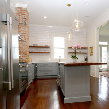 Open shelving and exposed brick are among the many details that encompass the si