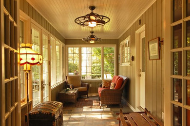 This is an example of a mid-sized traditional sunroom in Milwaukee with ceramic floors, no fireplace and a standard ceiling.